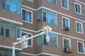 Close up on windows of appartment building and traffic cameras