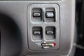 Close-up on windows control buttons near the door in the interior of an old Japanese car in gray after cleaning Royalty Free Stock Photo