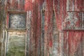 Close up of the windows on an old red barn