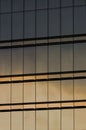 Close-up windows of skyscraper buildings and their glass facade with the sky Royalty Free Stock Photo