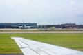 Close up of Wing of Airplane on Airplane waiting for Maintenance at the Airport Background Royalty Free Stock Photo