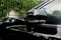 Wing left mirror of the black luxury car Royalty Free Stock Photo