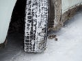 Close-up of a winter car tire tread with snow and ice Royalty Free Stock Photo