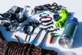 Close-up of winter climbing equipment on fresh snow on a sunny day. Carbines with a rope gazebo and zhumar as well as