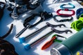 Close-up of winter climbing equipment on fresh snow on a sunny day. Carbines with a rope gazebo and zhumar as well as