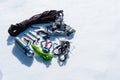 Close-up of winter climbing equipment on fresh snow on a sunny day. Carbines with a rope gazebo and zhumar as well as