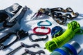 Close-up of winter climbing equipment on fresh snow on a sunny day. Carbines with a rope gazebo and zhumar as well as