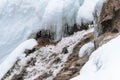 Close Up Winter Stream Framed by Snow and Blue Ice