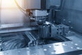 Close-up of the wire - EDM CNC machine while cutting the sample Royalty Free Stock Photo