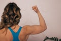 Close up of woman back with flexing her muscles. Female bodybuilder with perfect biceps Royalty Free Stock Photo