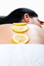 Close up of woman back skin with lemon Royalty Free Stock Photo