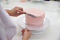 Close Up Of Woman In Bakery Decorating Cake With Icing Royalty Free Stock Photo