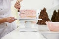 Close Up Of Woman In Bakery Decorating Cake With Icing Royalty Free Stock Photo