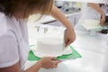 Close Up Of Woman In Bakery Decorating Cake With Royal Icing Royalty Free Stock Photo