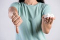 Close up woman beautiful hands holding white sugar cubes with thumbs down. Healthcare concept Royalty Free Stock Photo