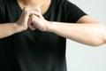 Close-up of woman is cracking her knuckles