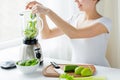 Close up of woman with blender and vegetables Royalty Free Stock Photo