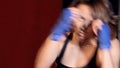 Close up of the woman with boxing handwraps trainig.
