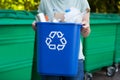 Close Up Of Woman Carrying Recycling Bin Royalty Free Stock Photo