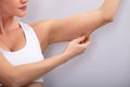 Woman Checking Excessive Fat On Her Arms