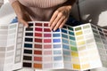 Close up of woman choose color from palette