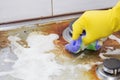 Close up of woman cleaning cooker at home kitchen Royalty Free Stock Photo