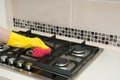 Close up of woman cleaning cooker at home kitchen Royalty Free Stock Photo