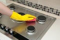 Close up of woman cleaning cooker at home kitchen Royalty Free Stock Photo