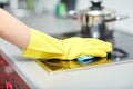 Close up of woman cleaning cooker at home kitchen Royalty Free Stock Photo