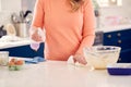 Close Up Of Woman Cleaning Kitchen Counter After Cake Baking Royalty Free Stock Photo