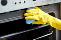 Close up of woman cleaning oven at home kitchen Royalty Free Stock Photo