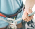 Close-up of woman climber belaying with rope and figure eight.