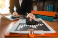 Close up woman doing finance at home office with calculate expenses. Royalty Free Stock Photo