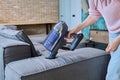 Close-up of woman doing house cleaning with vacuum cleaner Royalty Free Stock Photo