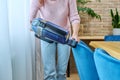 Close-up of woman doing house cleaning with vacuum cleaner Royalty Free Stock Photo