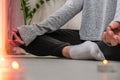 Close-up. Woman doing yoga exercise at home. Mindfulness meditation. Relax breathe easy pose gym healthy lifestyle Royalty Free Stock Photo