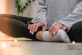 Close-up. Woman doing yoga exercise at home. Mindfulness meditation. Relax breathe easy pose gym healthy lifestyle Royalty Free Stock Photo