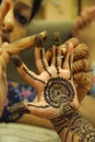 Close-up of woman drawing mehendi or tattoo on little girl`s palm Royalty Free Stock Photo