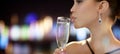 Close up of woman drinking champagne at party Royalty Free Stock Photo