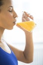 Close-Up Of Woman Drinking Fresh Orange Juice Royalty Free Stock Photo