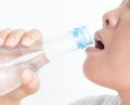 Close up woman drinking water from bottle on white background Royalty Free Stock Photo