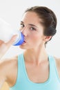 Close up of a woman drinking water at the gym Royalty Free Stock Photo