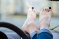 Close up of woman driver feet resting on car dashboard Royalty Free Stock Photo