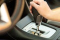 Close Up Of Woman Driver Holding Her Hand On Automatic Gear Shift Stick Driving As Car