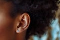 close-up of a woman ears with a pair of diamond earrings Royalty Free Stock Photo