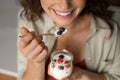 Close up of woman eating berries and yogurt Royalty Free Stock Photo