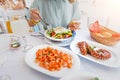 woman eating delicious seafood - shrimp and octopus grilled and vegetable salad. The concept of Mediterranean Royalty Free Stock Photo