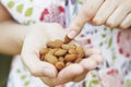 Close Up Of Woman Eating handful Of Almonds Royalty Free Stock Photo