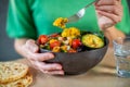 Close Up Of Woman Eating Healthy Vegan Meal In Bowl Royalty Free Stock Photo