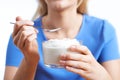 Close Up Of Woman Eating Natural Yogurt